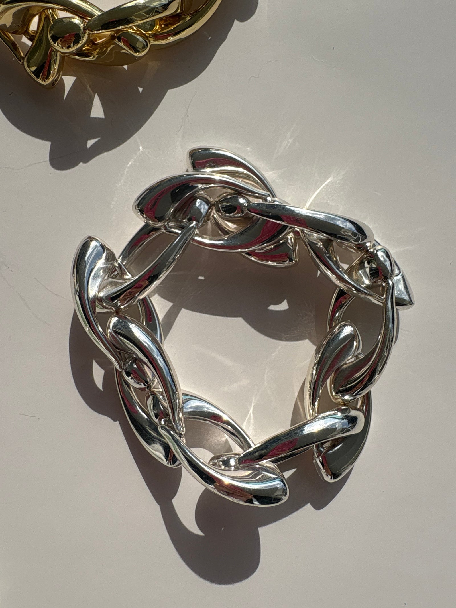 Culebra Bracelet — Insider Edition in sterling silver featuring lightweight hollow links with solid connector clasps, photographed in natural sunlight.