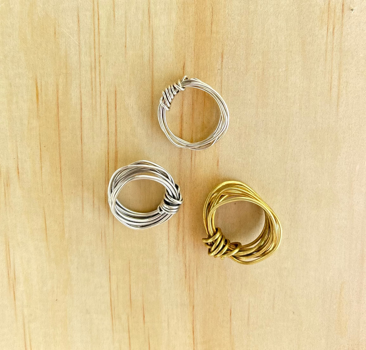 Handcrafted Amanda Ring by Jewelry One of a KIND, formed from a single 18-gauge wire into a sculptural knot without solder, available in brass and Fairmined sterling silver.