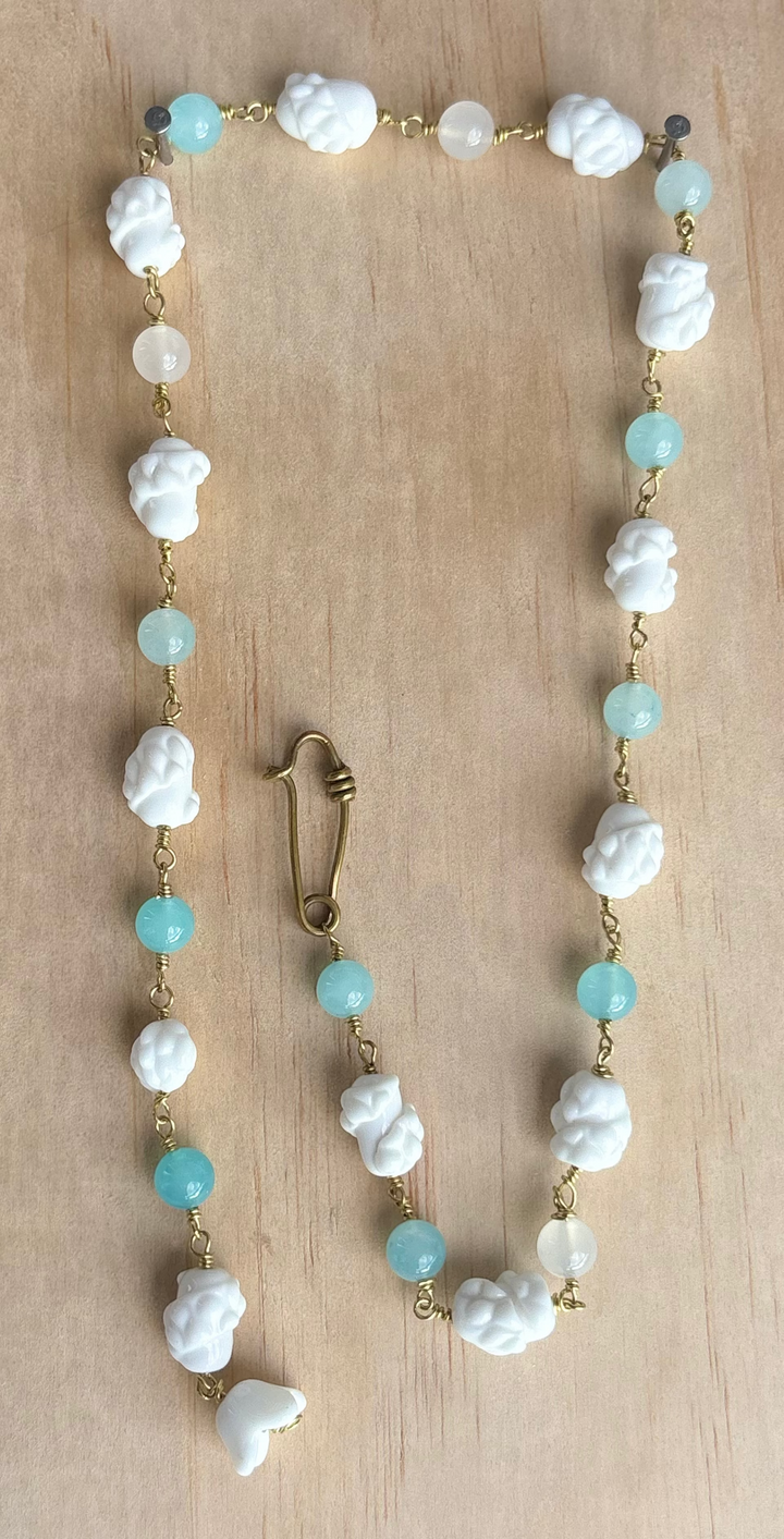 Blue quartz necklace and czech white porcelain. With signature brass safety pin closure. 